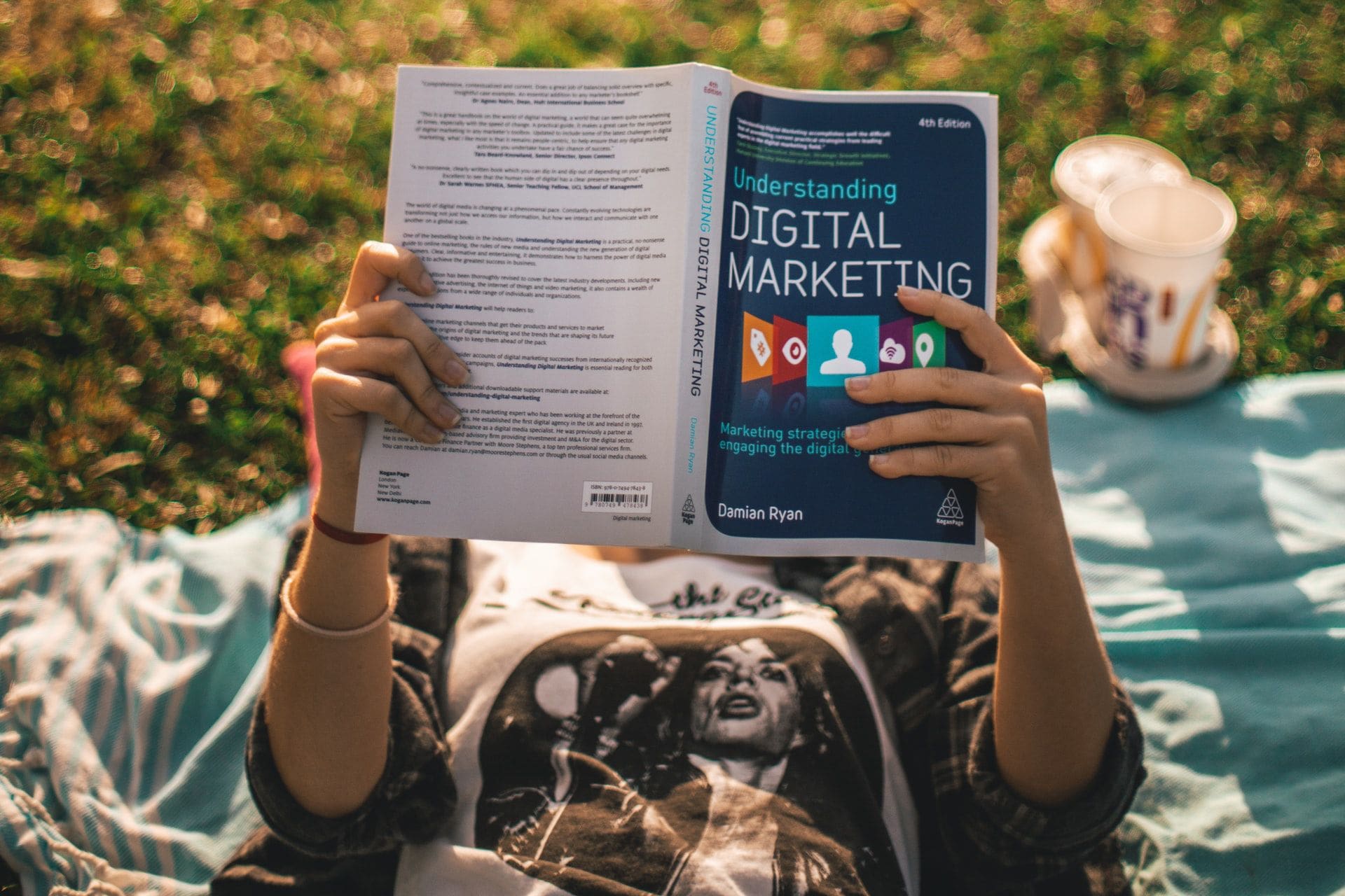 girl reading book about digital marketing girl reading book about digital marketing