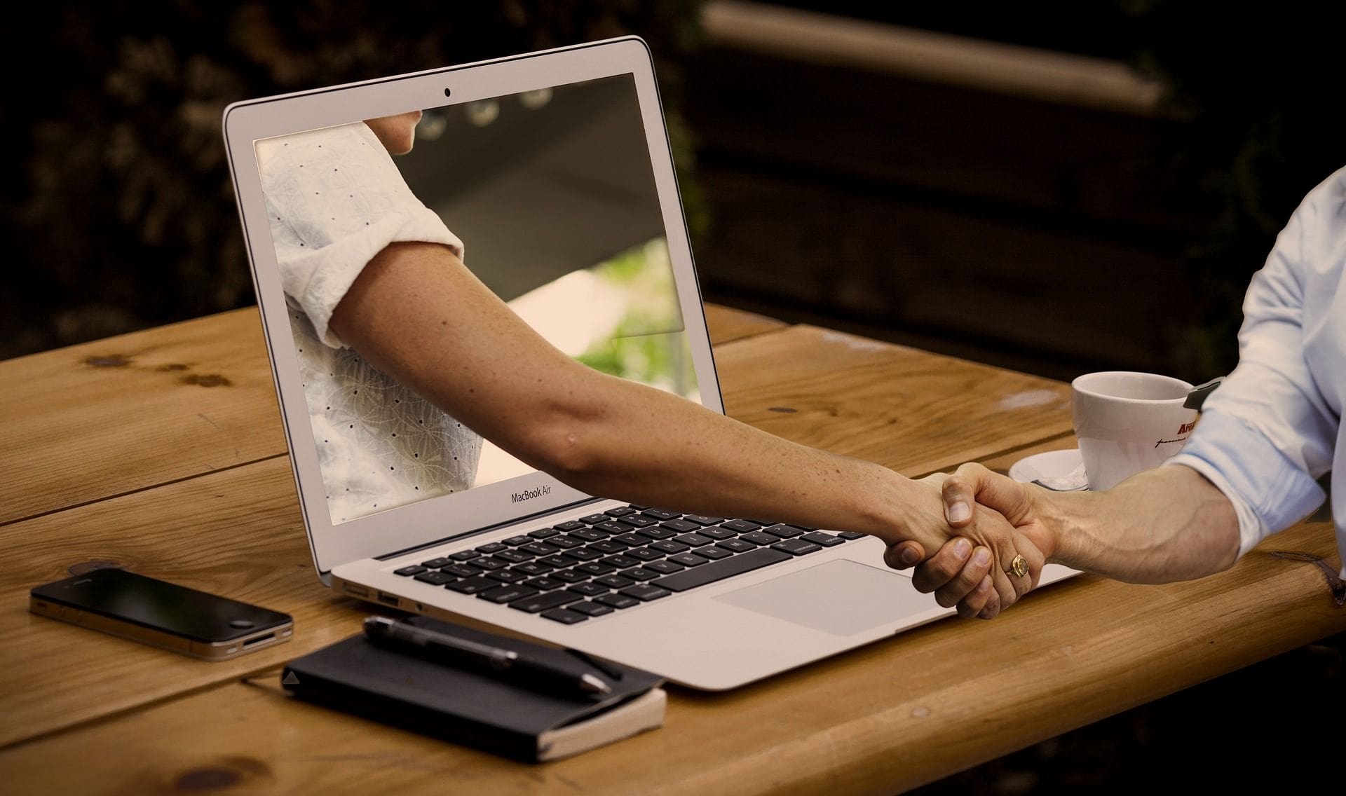Building Trust With Your Customers 1 handshake through computer screen